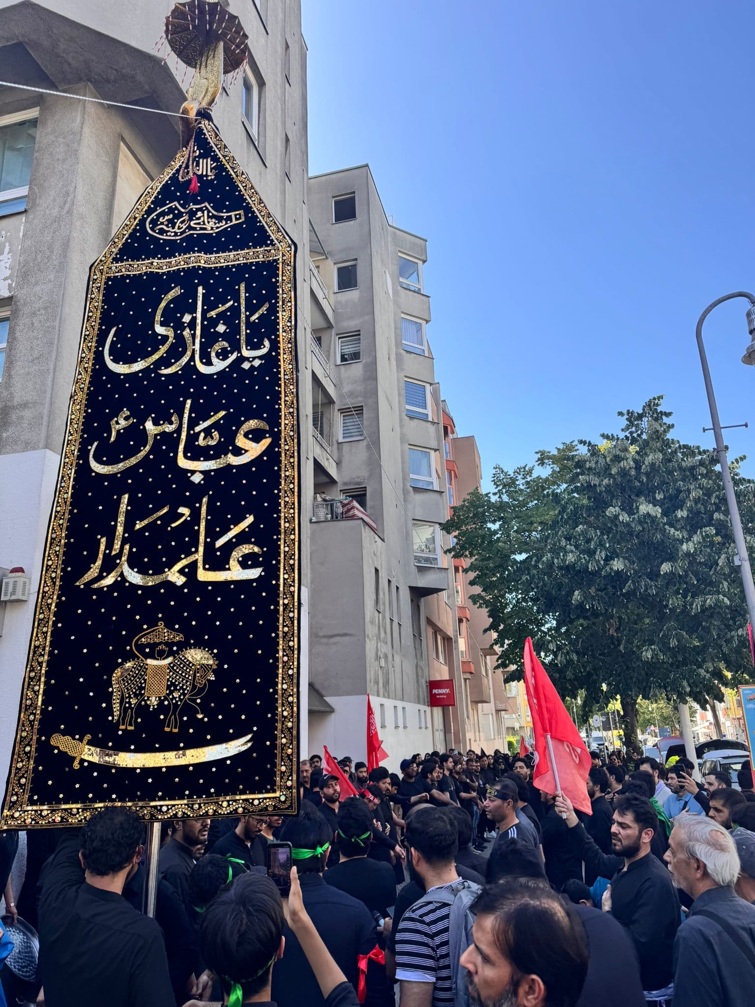 Alam raised during Juloos Ashura 2026 in Berlin